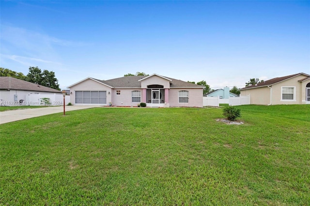 ranch-style home with a front yard and a garage