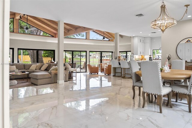 tiled dining space featuring a notable chandelier, high vaulted ceiling, and beam ceiling