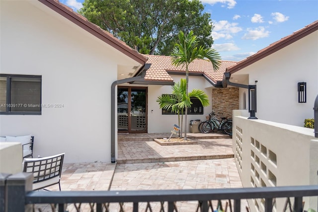 doorway to property featuring a patio