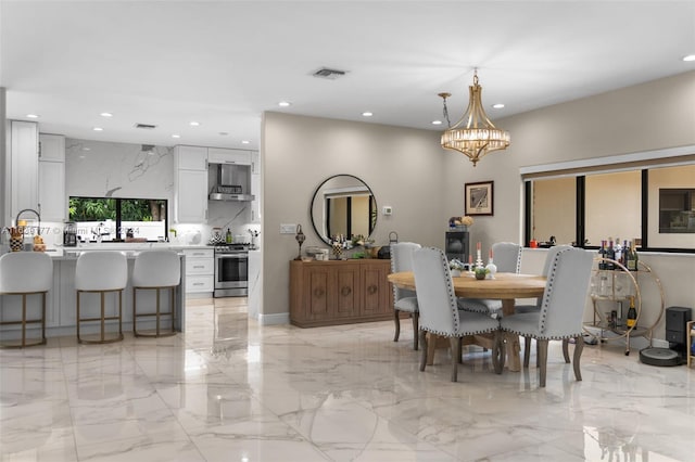 dining area with an inviting chandelier