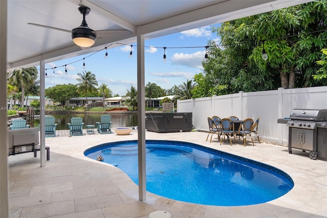 view of swimming pool with a water view, ceiling fan, grilling area, and a patio area