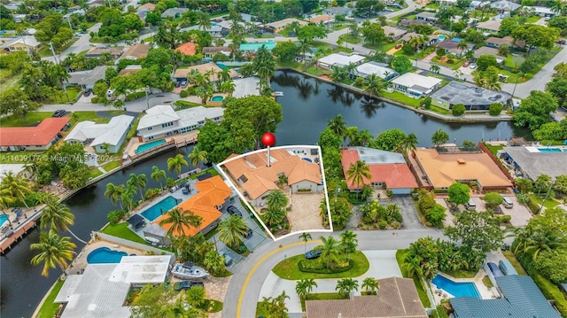 birds eye view of property featuring a water view