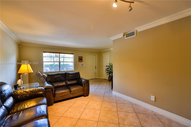 tiled living room with rail lighting and crown molding