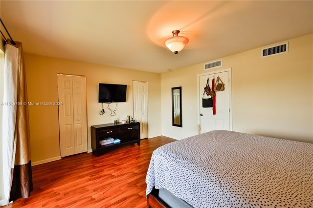 bedroom with wood-type flooring