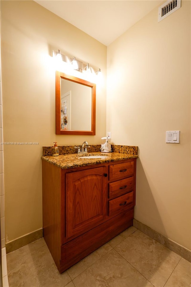 bathroom featuring tile patterned floors and vanity