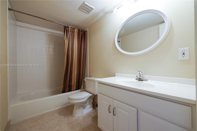 full bathroom with tile patterned floors, vanity, toilet, and shower / bath combo