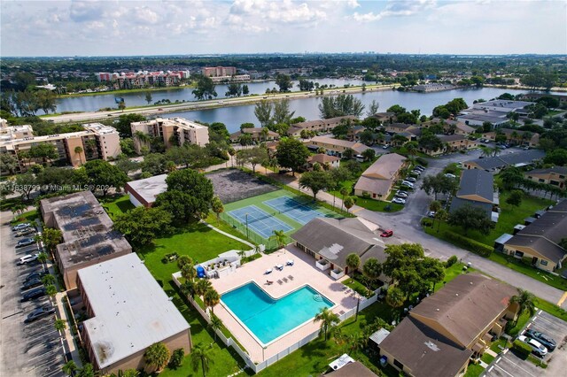 birds eye view of property with a water view