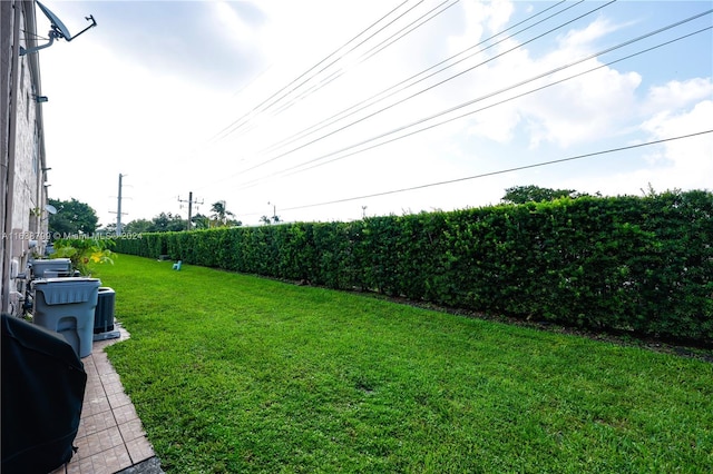 view of yard featuring central air condition unit