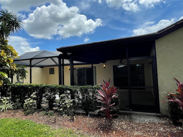 rear view of house with glass enclosure