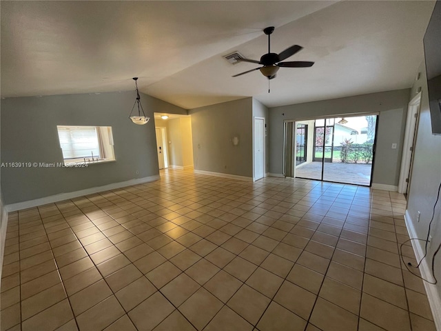 unfurnished room featuring light tile patterned floors, plenty of natural light, vaulted ceiling, and ceiling fan