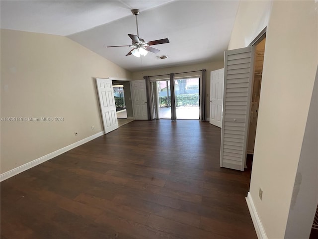 unfurnished room featuring vaulted ceiling, dark hardwood / wood-style flooring, and ceiling fan