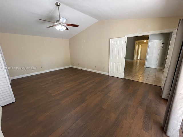 unfurnished bedroom with ceiling fan, wood-type flooring, and lofted ceiling