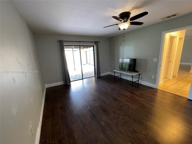 unfurnished living room with ceiling fan and wood-type flooring