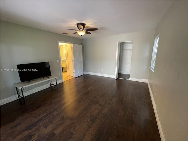 unfurnished living room featuring ceiling fan and hardwood / wood-style flooring