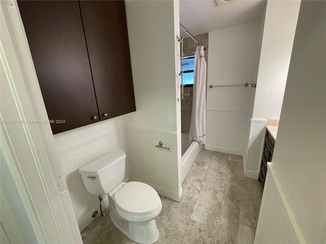 bathroom with vanity, walk in shower, toilet, and tile patterned flooring