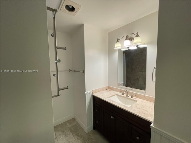 bathroom with vanity and tile patterned flooring