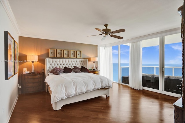 bedroom featuring dark hardwood / wood-style flooring, crown molding, access to exterior, ceiling fan, and a water view