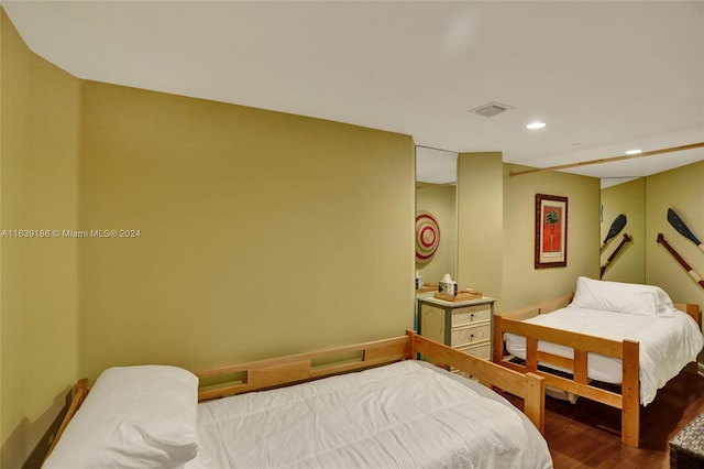 bedroom featuring wood-type flooring