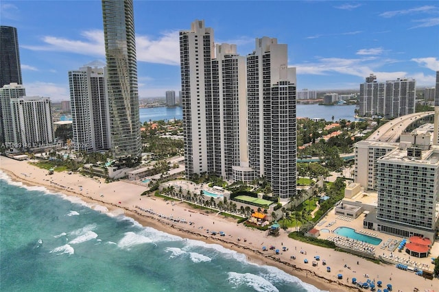 aerial view featuring a water view and a beach view