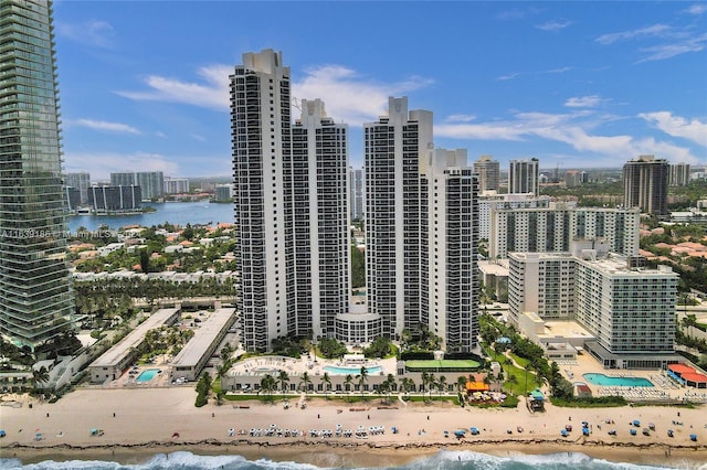 city view featuring a beach view and a water view