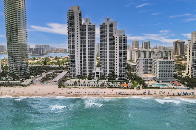 exterior space featuring a view of the beach and a water view