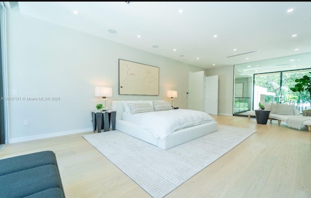 bedroom with light hardwood / wood-style flooring