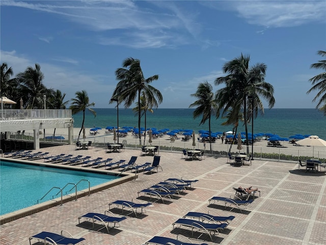 view of pool featuring a water view