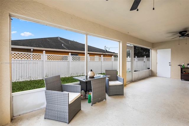 view of patio / terrace with a fenced backyard and a ceiling fan