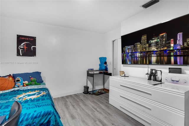 bedroom with light wood-type flooring