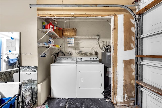 clothes washing area featuring independent washer and dryer