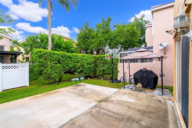 view of patio / terrace with a gazebo and grilling area