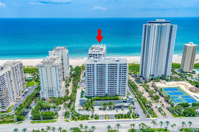 bird's eye view with a water view and a view of the beach