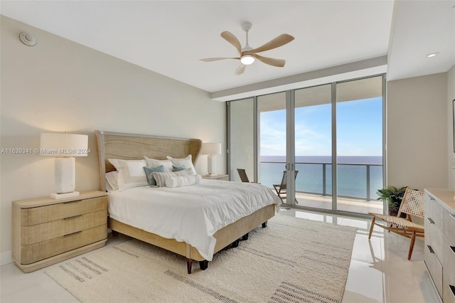 bedroom with floor to ceiling windows, light tile patterned flooring, access to outside, and a water view