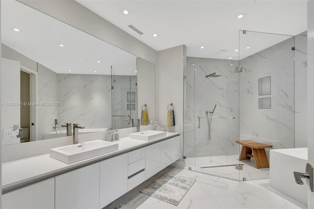 bathroom with tile walls, double vanity, tile patterned flooring, and an enclosed shower