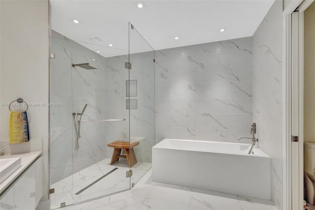 bathroom featuring tile patterned floors, tile walls, vanity, and shower with separate bathtub