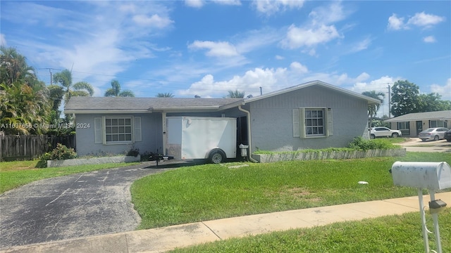 ranch-style house with a front yard