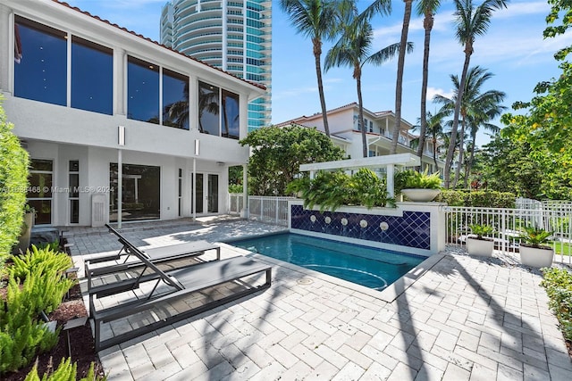 view of swimming pool with a patio area