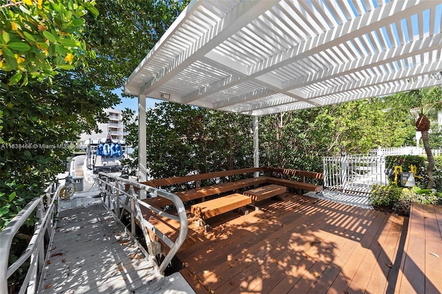 view of patio / terrace with a wooden deck and a pergola