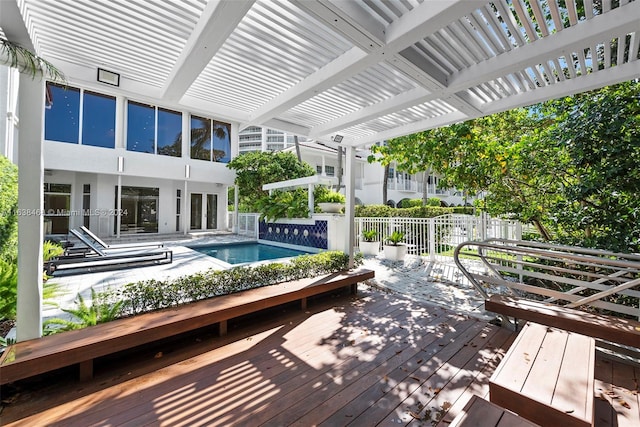 view of swimming pool featuring a deck