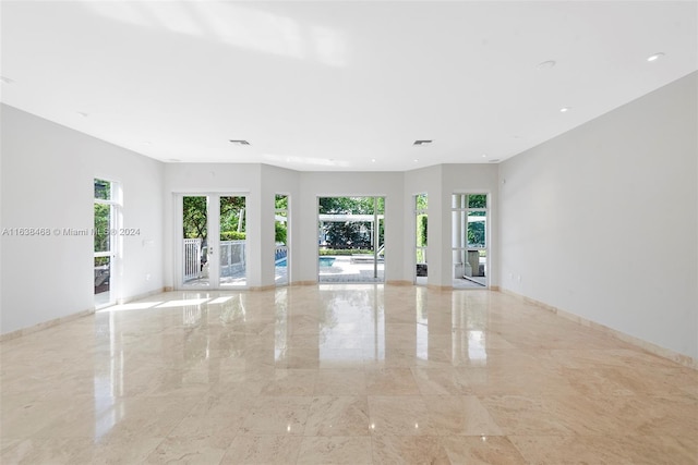 unfurnished room with french doors