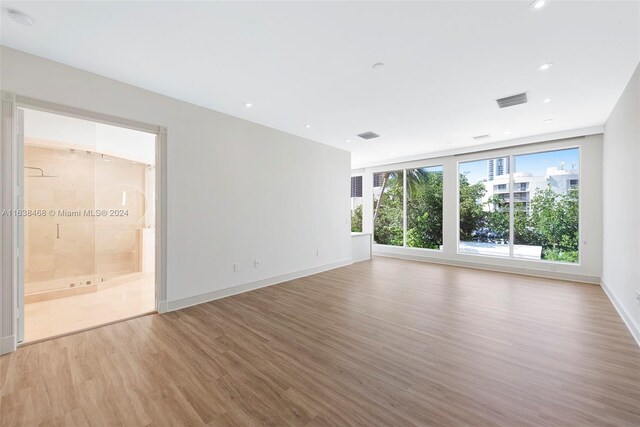 spare room featuring light hardwood / wood-style flooring