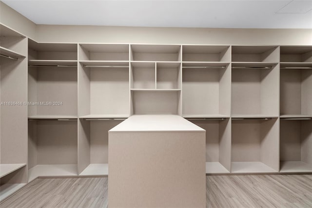 spacious closet featuring light wood-type flooring