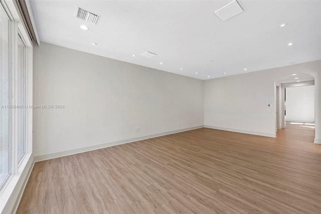 spare room featuring light hardwood / wood-style floors