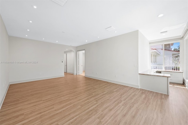 empty room with light wood-type flooring