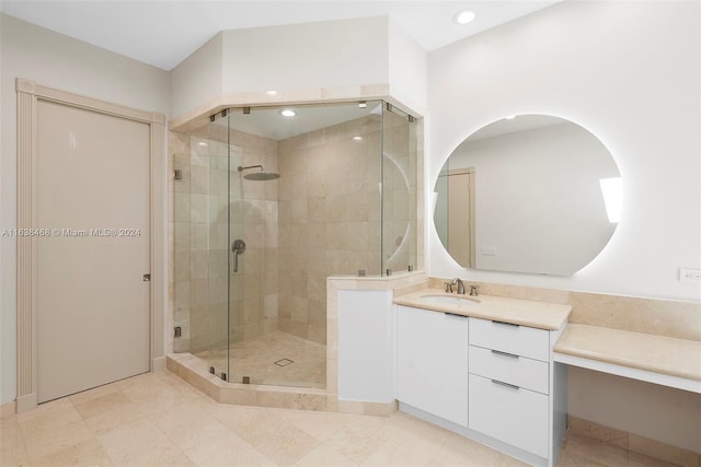 bathroom with vanity and a shower with shower door