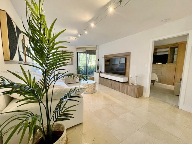 tiled living room with rail lighting