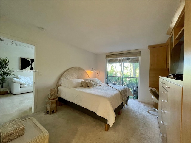 carpeted bedroom featuring access to outside