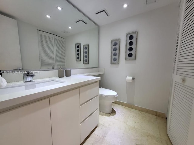 55 Ocean Lane Dr Unit 2030, Key Biscayne, FL 33149 - bathroom featuring a closet, toilet, vanity, recessed lighting, and baseboards