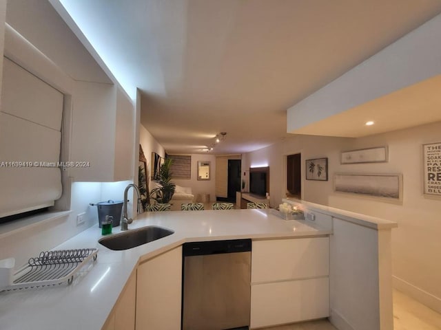 55 Ocean Lane Dr Unit 2030, Key Biscayne, FL 33149 - kitchen with stainless steel dishwasher, a sink, light countertops, white cabinets, and open floor plan