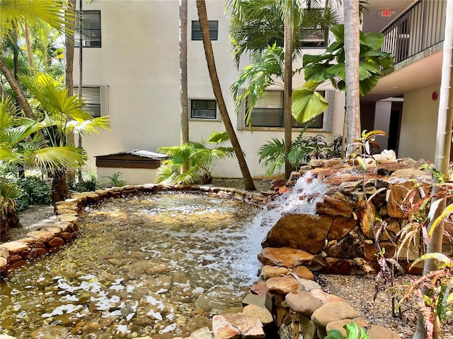 view of yard with a balcony